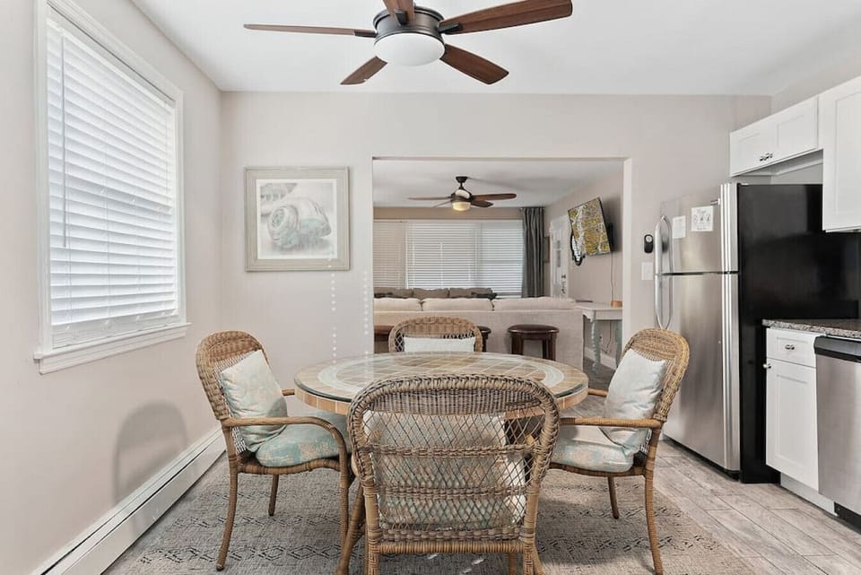 The large windows offer stunning views and ample natural light, while the stylish decor and artwork create a sophisticated and welcoming atmosphere.