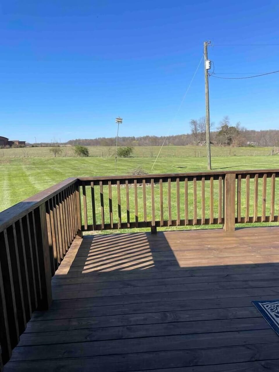 Look for wildlife from the deck of this peaceful back yard!
