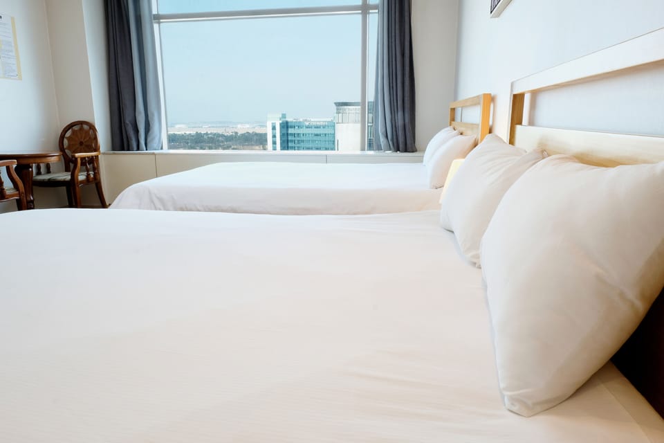 Twin Room (Must contact Hotel before check-in) | Blackout drapes, free WiFi