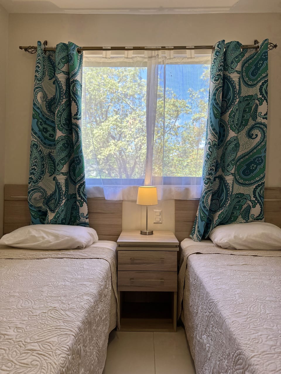 Two single beds in the spare bedroom with closet storage 