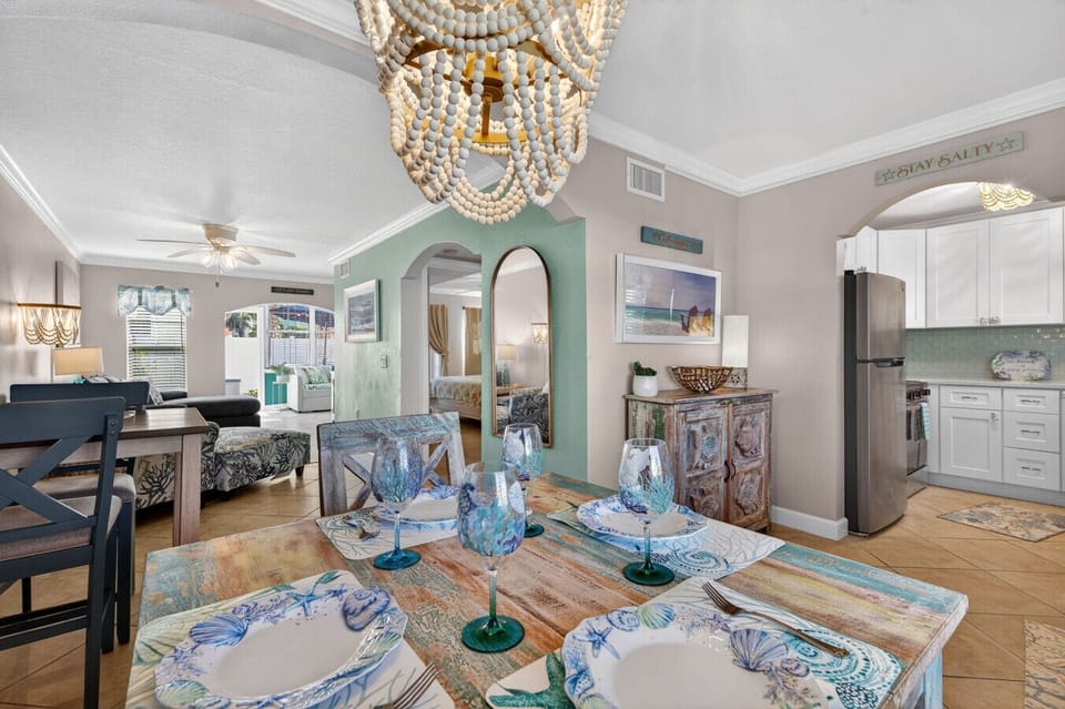 Spacious living & dining area w/ comfy seating, coastal décor & warm lighting.