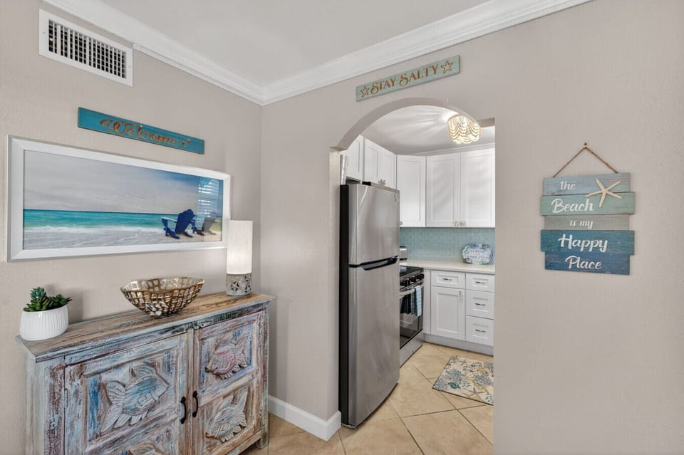 Convenient laundry nook w/ washer & dryer tucked neatly into the space.