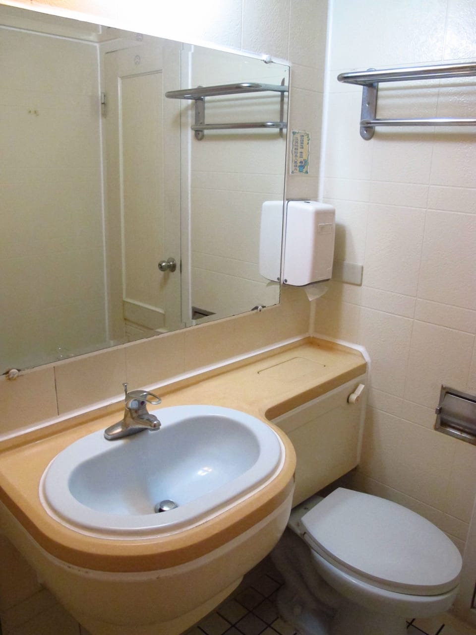 Shower, hair dryer, slippers, towels