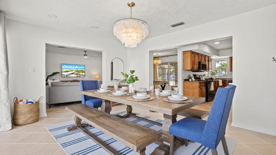 Share meals and moments at a beautiful dining table with cozy seating for up to eight guests.