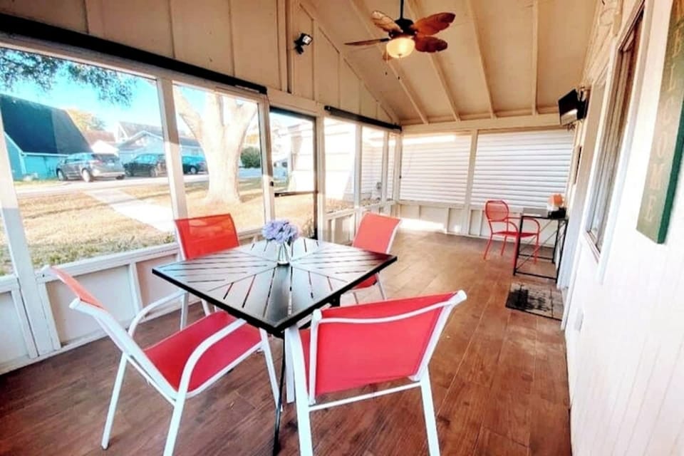 The completely enclosed front porch area give your group plenty of extra space to enjoy!  there is a smart TV and Small Desk as well on the porch!