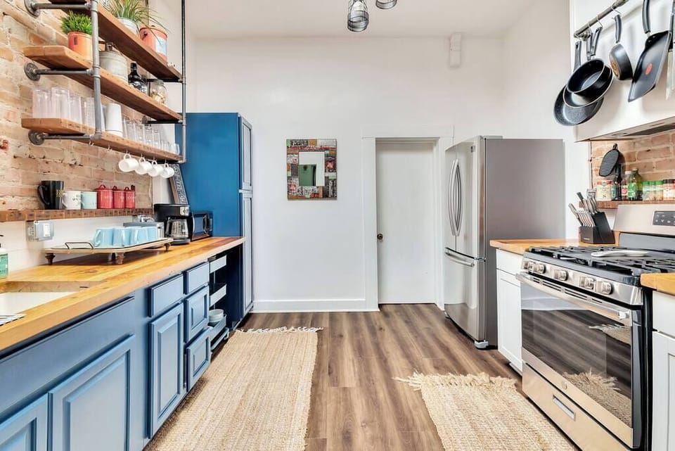 fully stocked kitchen with a stainless steel fridge and freezer