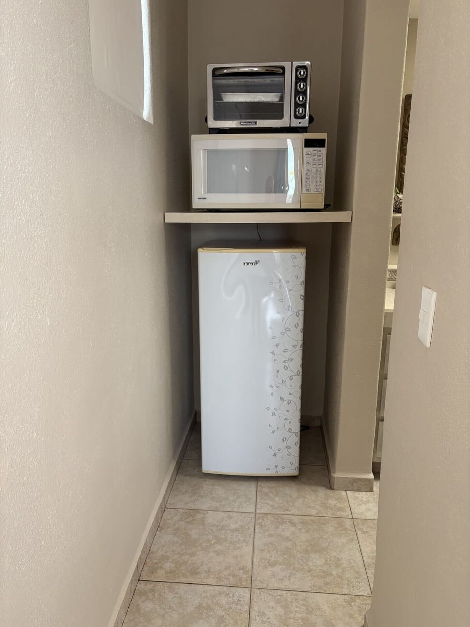 Fridge, microwave and toaster oven in optional 3rd bedroom space.