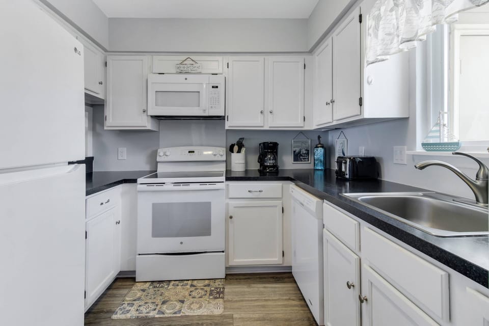 This Galley Kitchen has everything you need to make Delicious Meals while on Vacation.