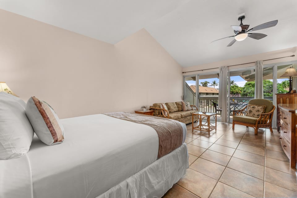 Ceiling fan and window A/C unit help to stay cool