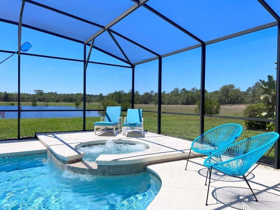 Unwind in the private pool and spa area with a Lake view  featuring ample outdoor seating for relaxing and gathering. Pool heat is available for an additional fee, making it enjoyable year-round.