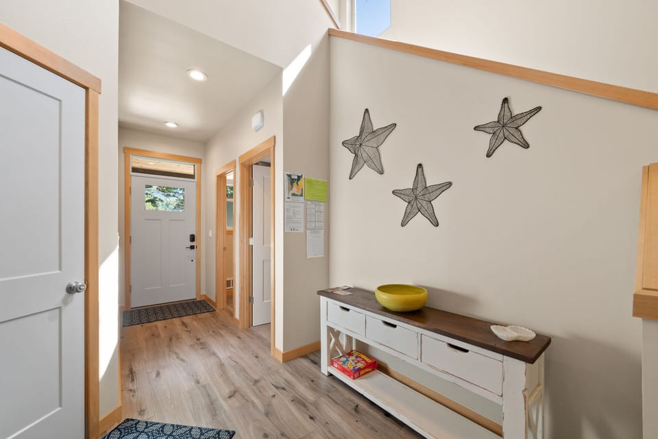 Entry - Entry way with 1/2 bath and stairs leading to second story.