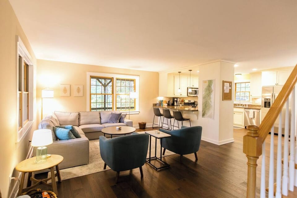 Cozy and inviting living room with beautiful wooded views 