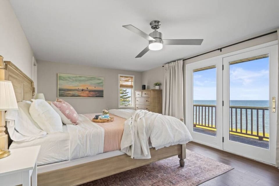 Wake up to a breathtaking sunrise over Lake Huron in this luxrious King bed