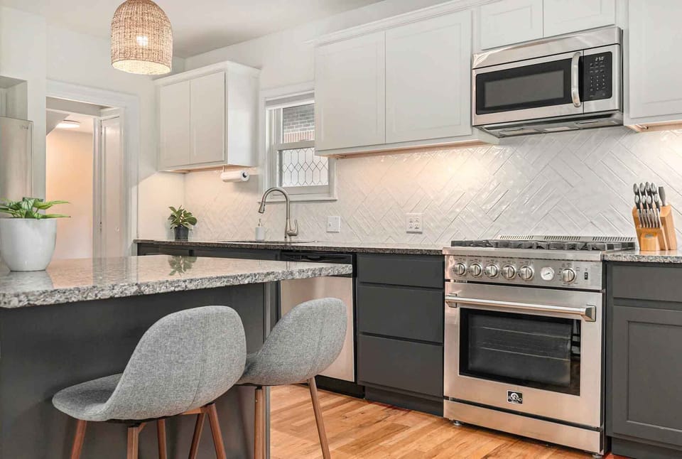 A breakfast bar at the kitchen island provides extra seating for 2