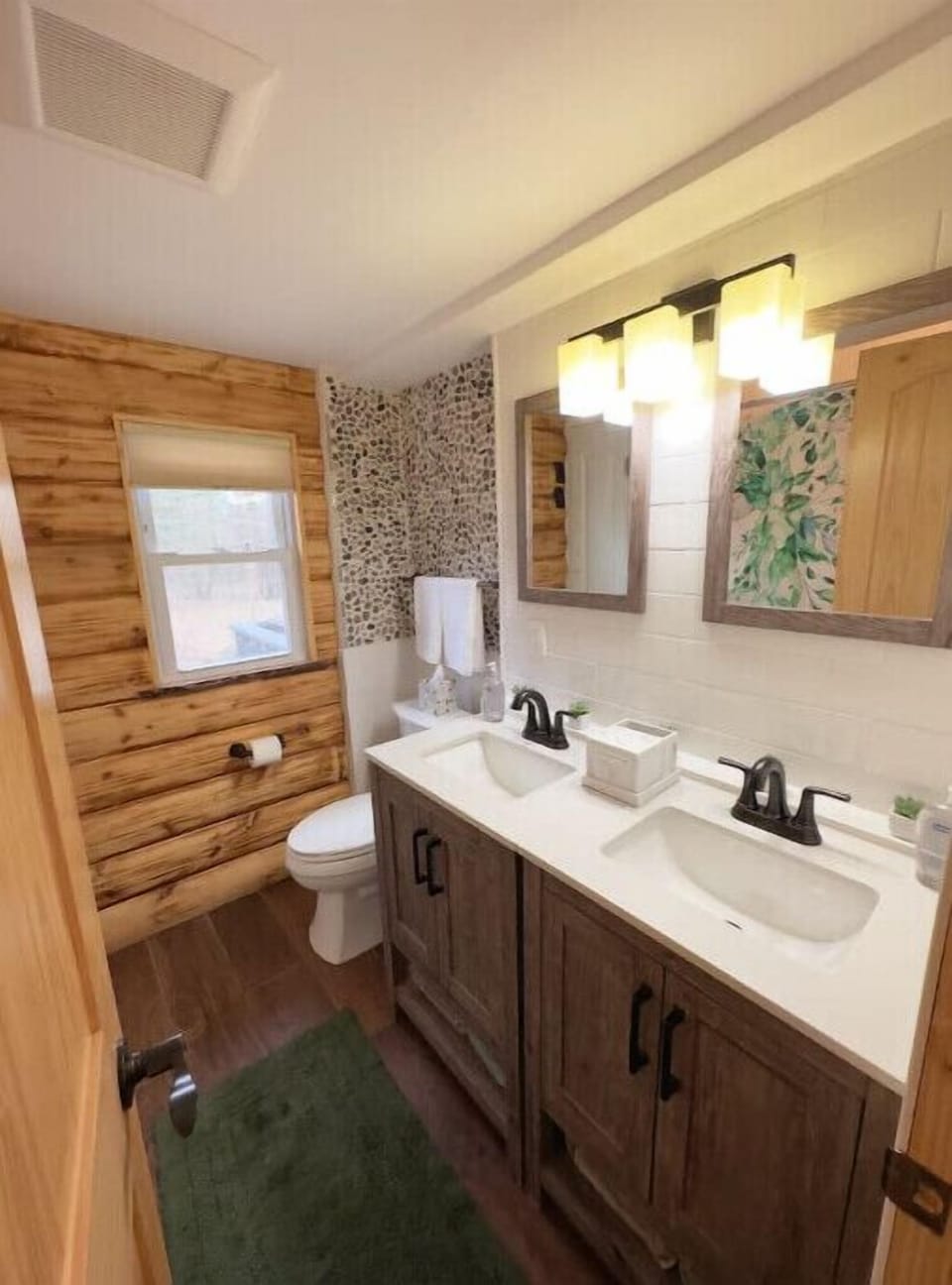 Full bathroom with tub and double sink