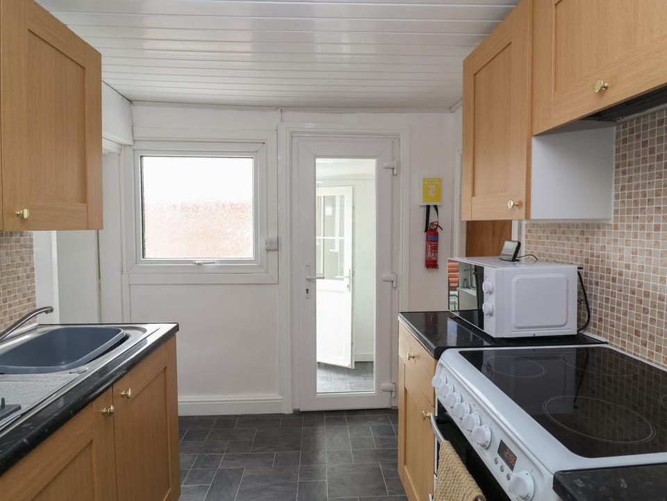 Fridge, electric kettle, toaster, cookware/dishes/utensils