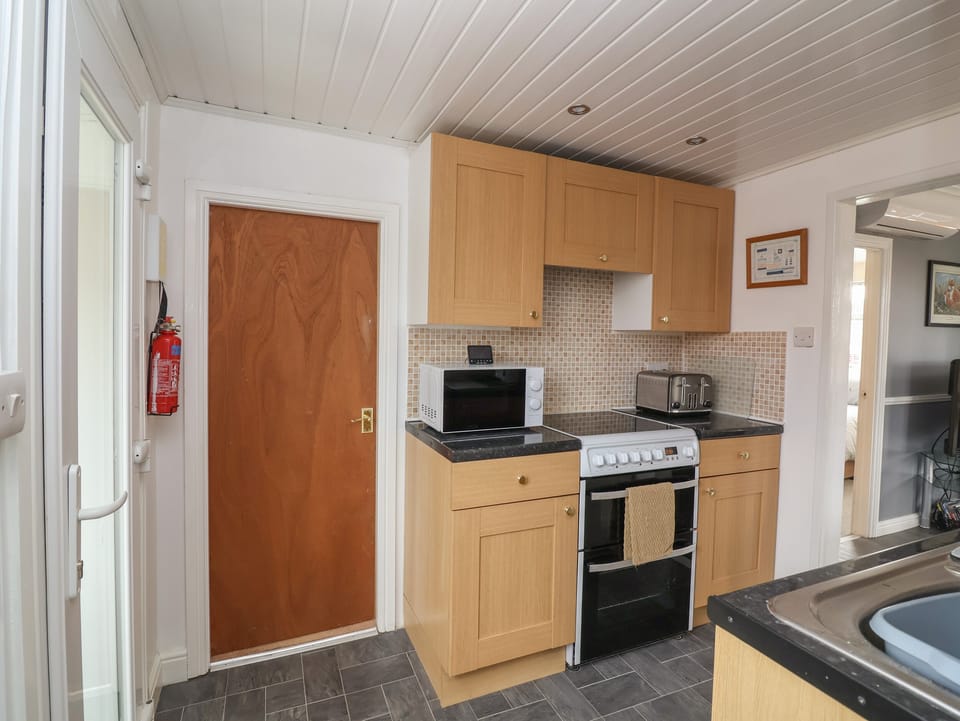 Fridge, electric kettle, toaster, cookware/dishes/utensils
