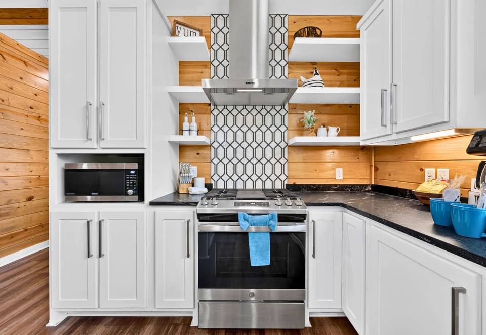 Stainless steel appliances and plenty of cabinetry give the kitchen everything you need to settle in and enjoy the convenience of cooking right at the cabin.