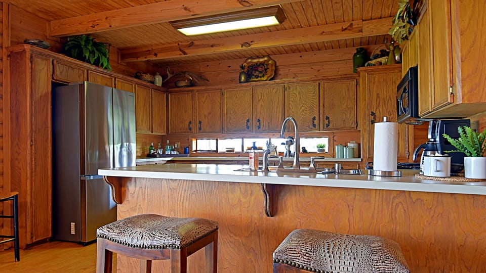 Well stocked kitchen with everything to cook and serve meals for your stay