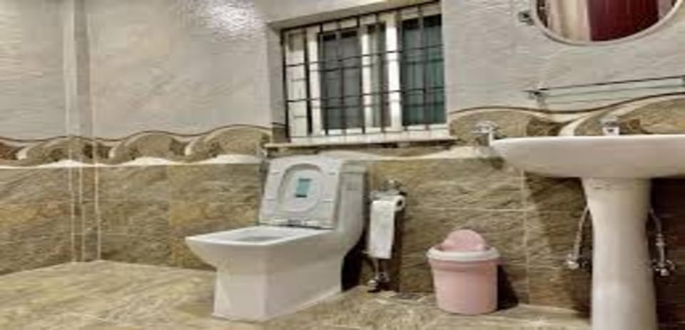 Shower, rainfall showerhead, towels, soap