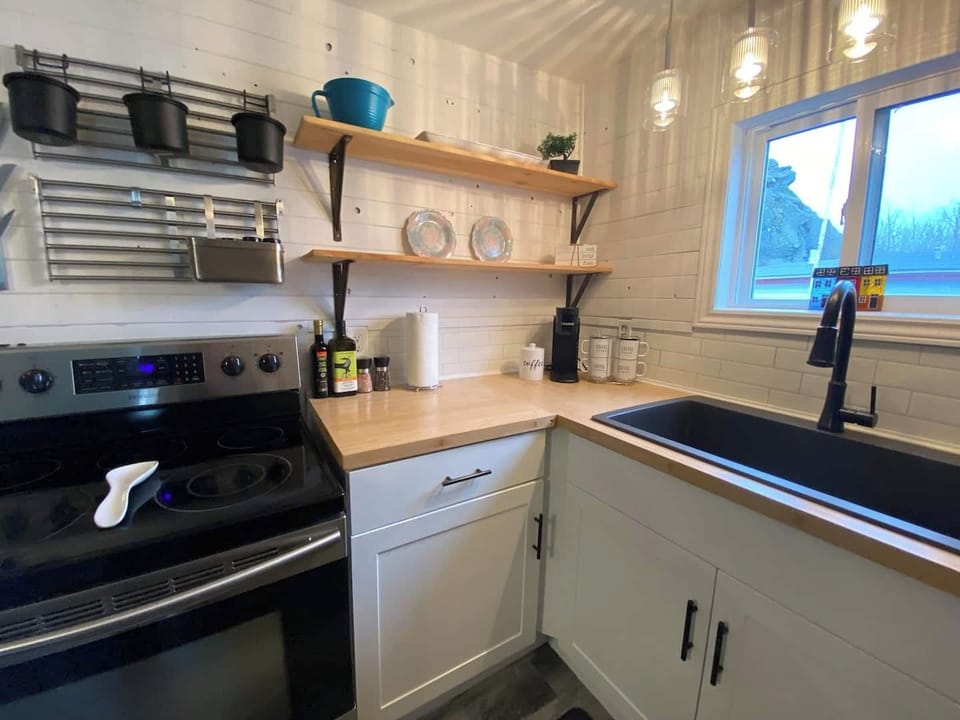 Prepare delicious meals in the fully equipped kitchen, complete with modern appliances and cookware