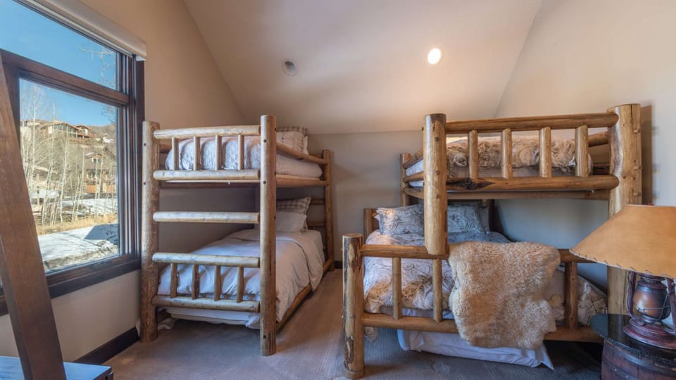 Bedroom 4 features a twin-over-twin bunk bed and a twin-over-full bunk bed.