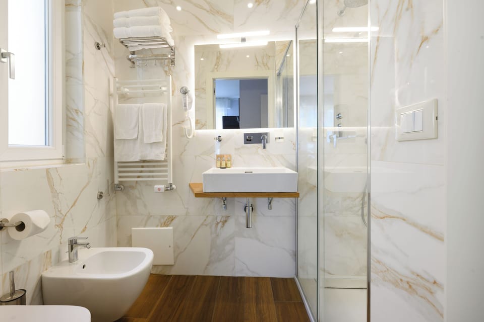 Family Triple Room | Bathroom | Shower, rainfall showerhead, hair dryer, bidet