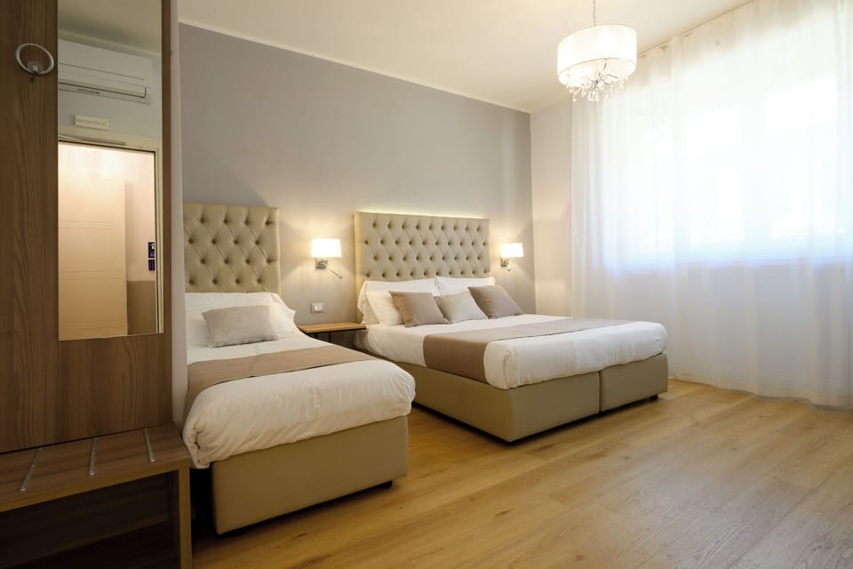Family Triple Room | In-room safe, desk, laptop workspace, soundproofing