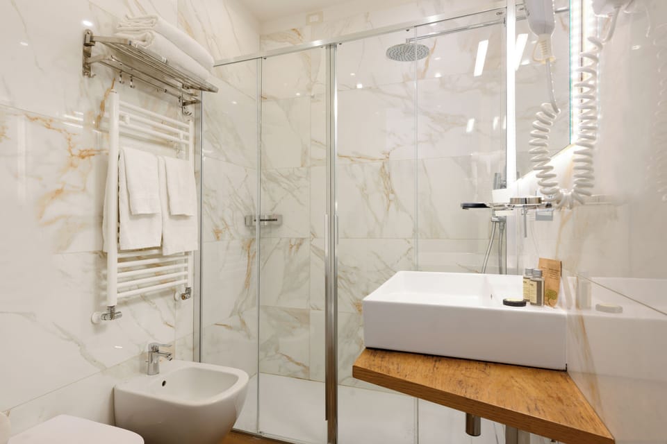 Family Triple Room | Bathroom | Shower, rainfall showerhead, hair dryer, bidet
