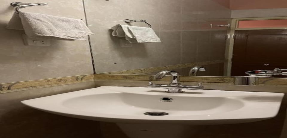 Shower, rainfall showerhead, towels, soap