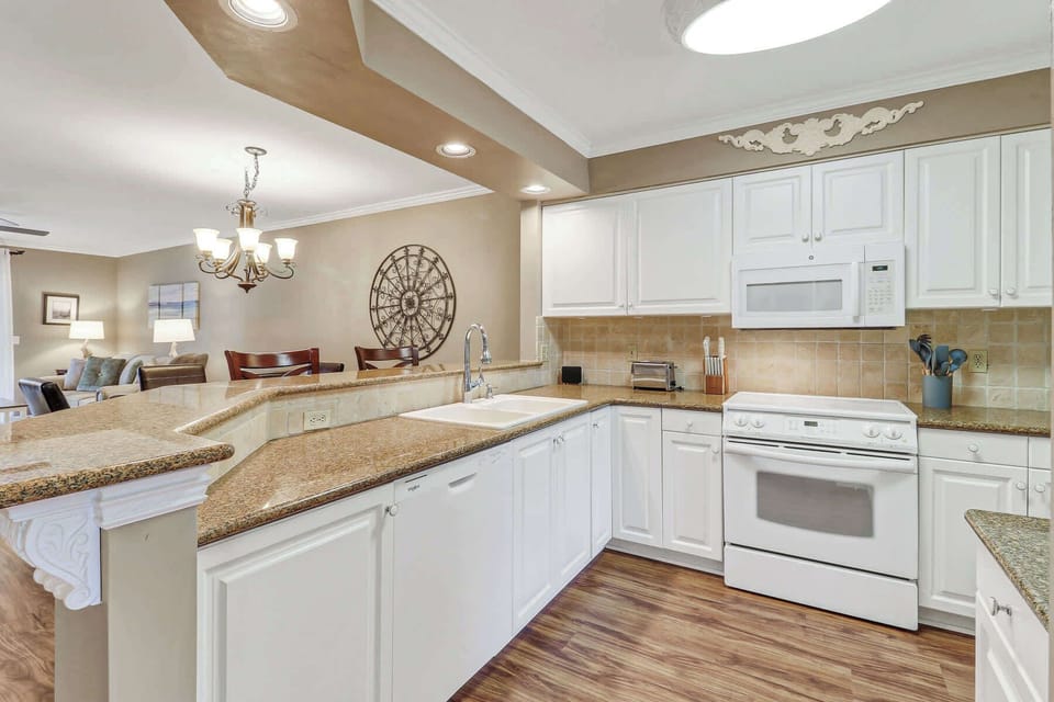 Kitchen fully stocked with cookware and dishware
