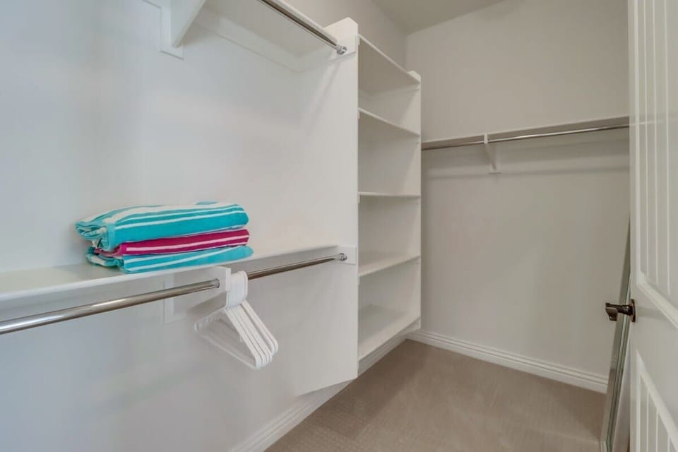Plenty of space for wardrobe and storage int he master closet
