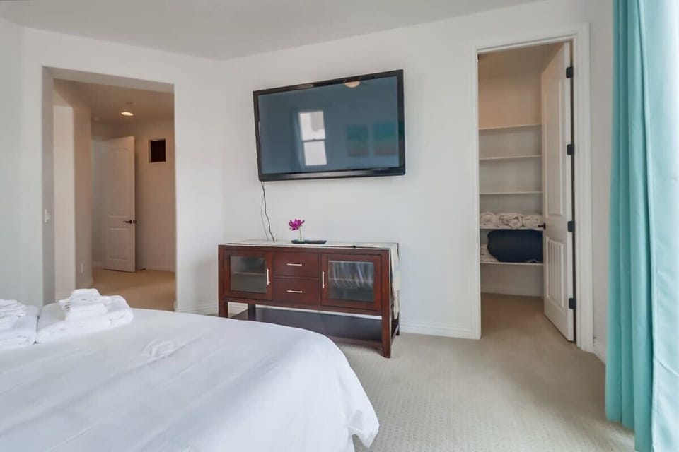 Masted bedroom with mounted TV