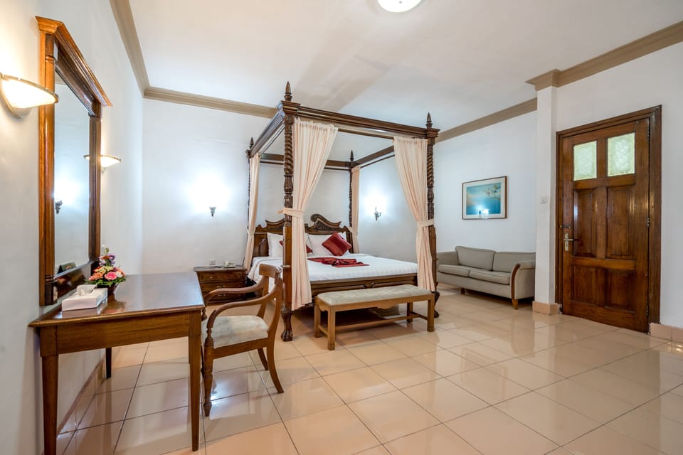 Suite, Garden View | Bathroom | Combined shower/tub, deep soaking tub, free toiletries, hair dryer