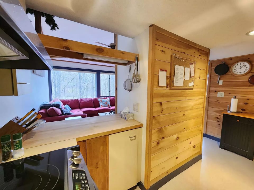 Another view of the kitchen with breakfast bar with seating