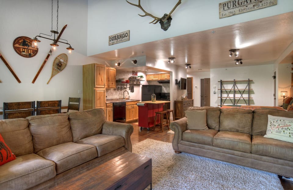 Living Room with Comfortable Furniture, Modern Mountain Decor, and Smart TV