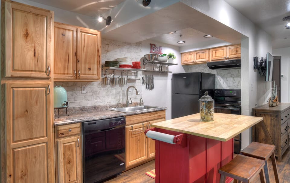 Fully Stocked Kitchen with Kitchen Island and Breakfast Bar Seating