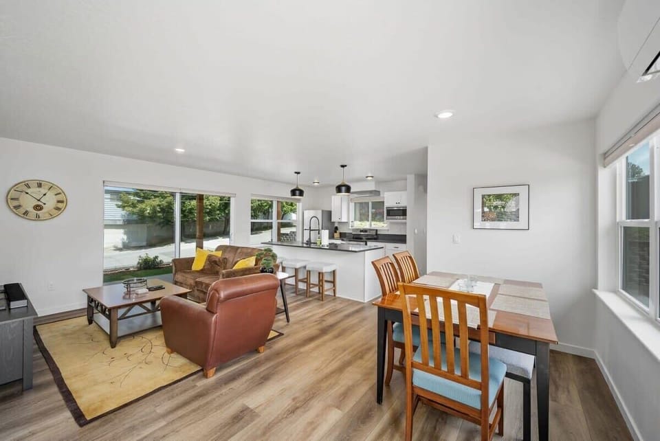 Step into your open-concept sanctuary where natural light floods the modern kitchen and cozy living space, creating the perfect backdrop for relaxing evenings.