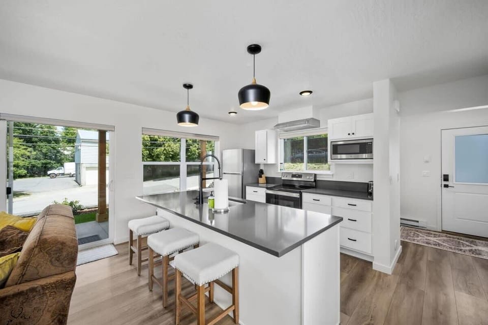 Gather around the spacious kitchen island where you'll find everything needed to create memorable meals together.