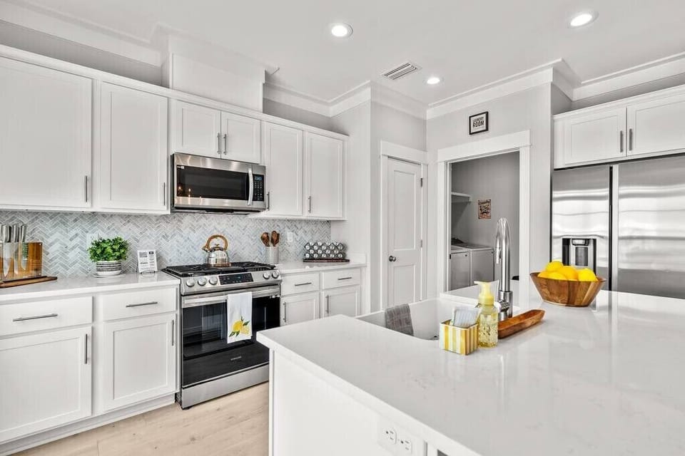 Fully stocked kitchen, gas range, and farmhouse sink to meet all your cooking needs!