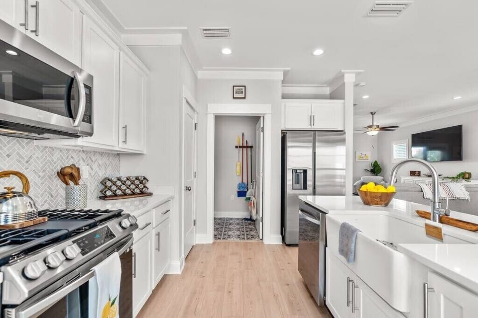 Tons of cabinet space and access to laundry room!