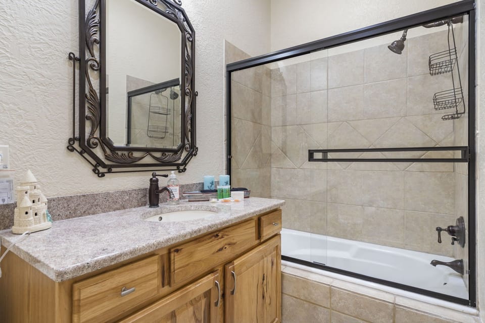Spacious bathroom with an entry to the bunk bedroom and the living room.