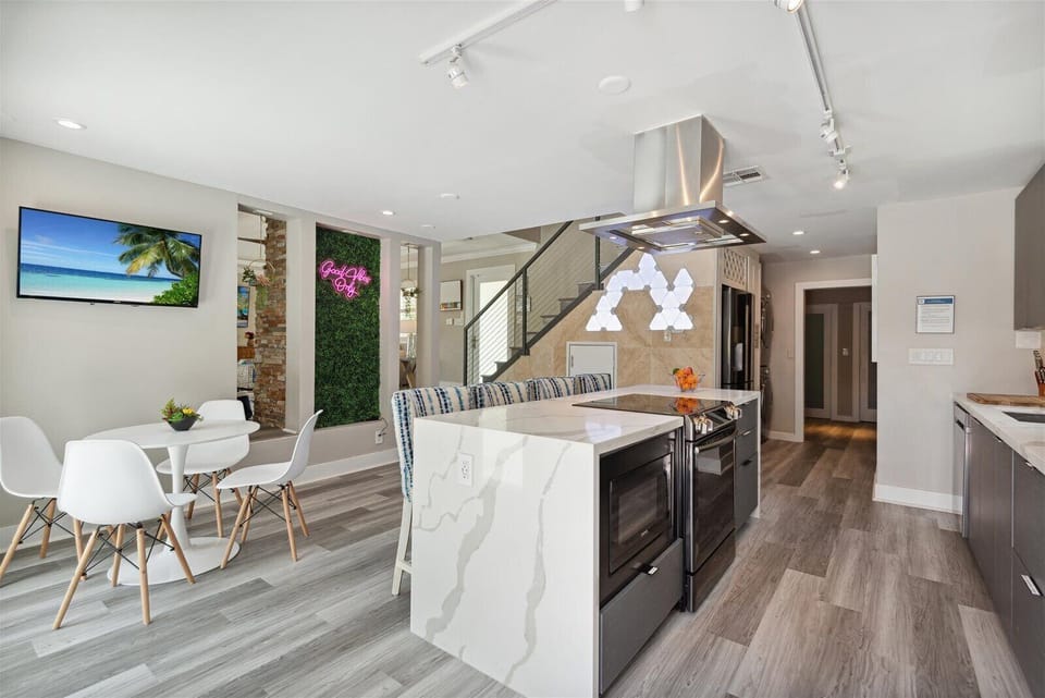 Eat in kitchen with large TV and kitchen island