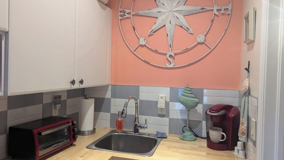Remodeled kitchenette has frig, microwave, Kuerig and regular coffee maker 