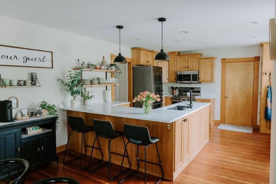Large kitchen area. Island seats three additional guests.