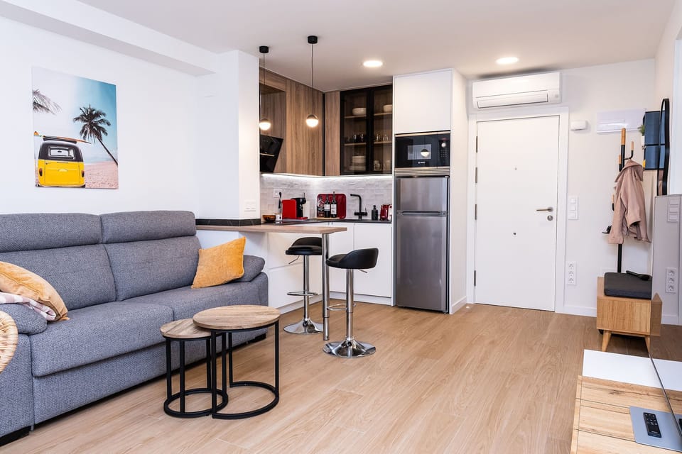 Living room with bar table and kitchen