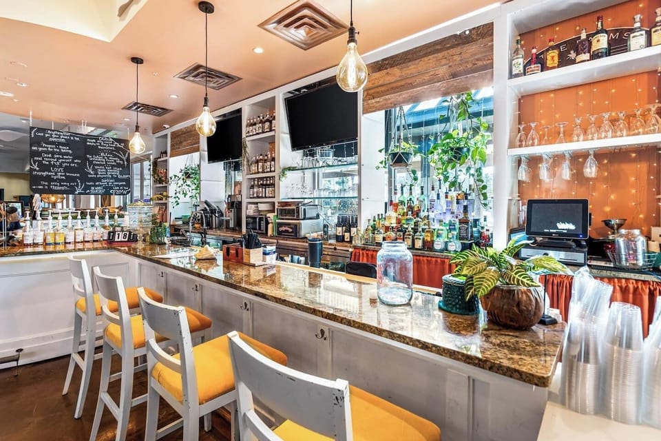 Stylish bar area on-site w/ polished counters & inviting seating for evening drinks
