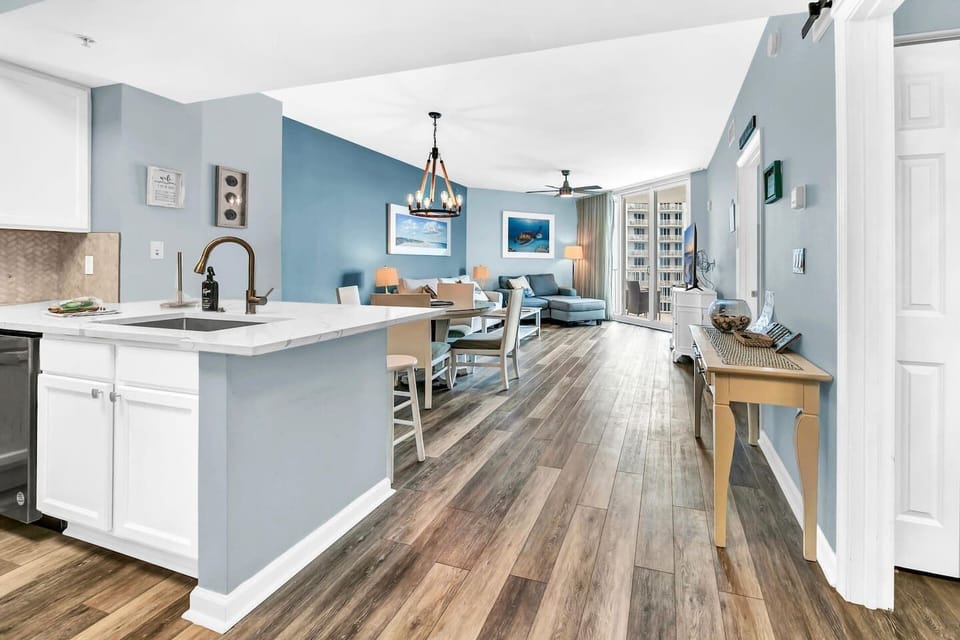 Open-concept view from the kitchen into dining & living areas, creating an easy, airy flow