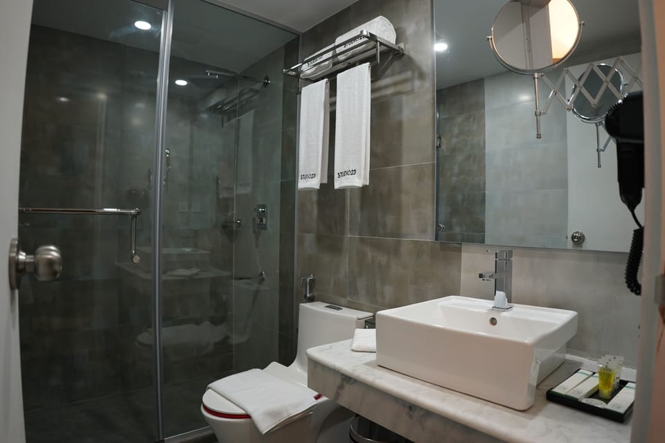 Shower, rainfall showerhead, designer toiletries, hair dryer