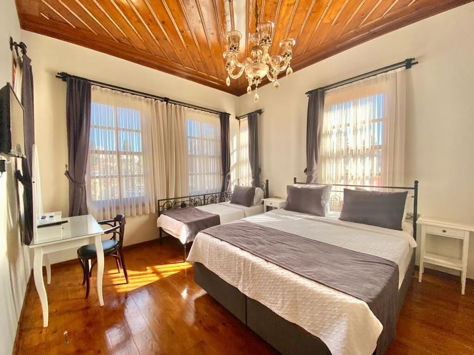 Family Triple Room, 1 Bedroom, City View | In-room safe, iron/ironing board, free WiFi, bed sheets
